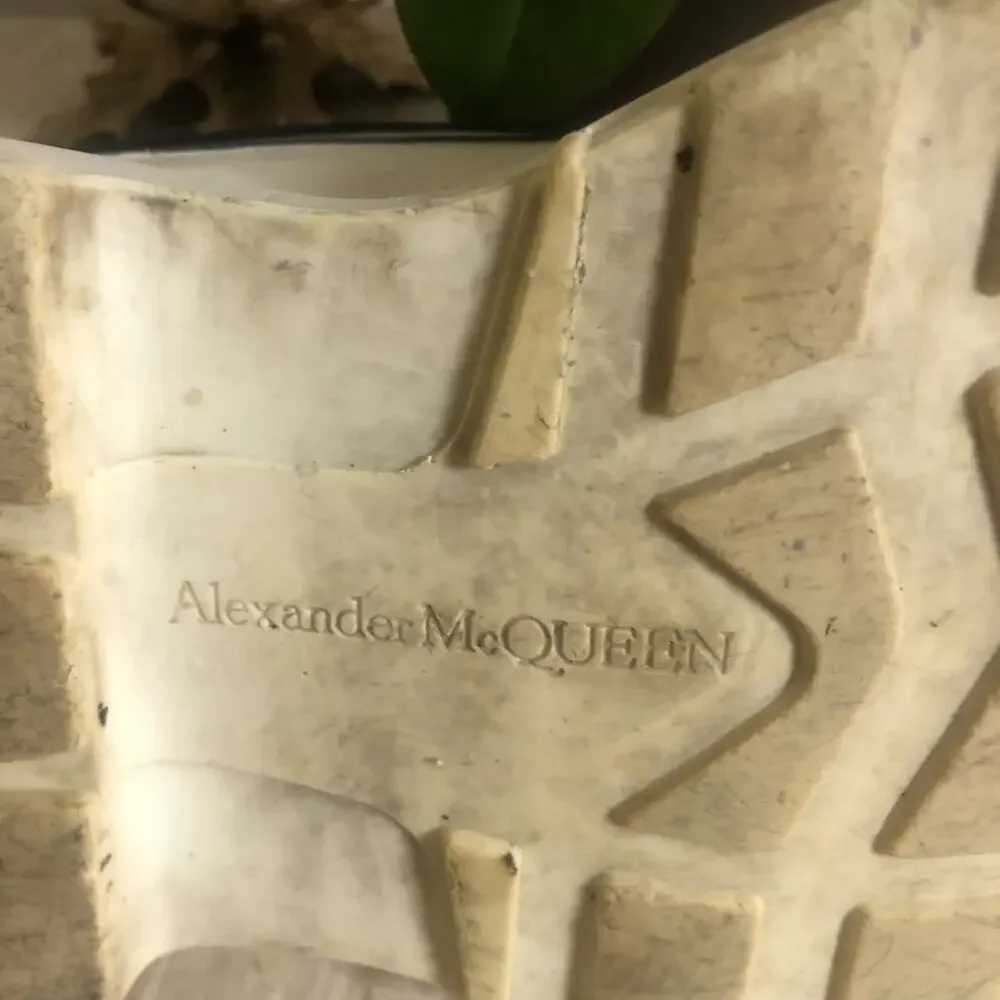 Alexander McQueen black and white platform chucks.